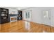 Bright living room with a marble fireplace, built-in shelving, and access to the backyard at 2350 Twelvestones Dr, Roswell, GA 30076