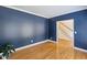Living room with hardwood floors and an open entry into the house at 2350 Twelvestones Dr, Roswell, GA 30076