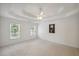Spacious main bedroom with trey ceilings and large windows that offer natural light at 2350 Twelvestones Dr, Roswell, GA 30076