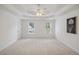 Spacious main bedroom with trey ceilings and large windows that offer natural light at 2350 Twelvestones Dr, Roswell, GA 30076