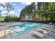 Community pool with lounge chairs and manicured landscaping at 2350 Twelvestones Dr, Roswell, GA 30076