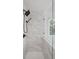 Close up of the frameless marble tiled shower at 2350 Twelvestones Dr, Roswell, GA 30076