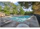 A community swimming pool surrounded by lounge chairs and lush greenery, perfect for relaxation and recreation at 2350 Twelvestones Dr, Roswell, GA 30076