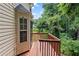 This back deck overlooks the backyard and provides access to the home's interior at 26 Springbottom Dr, Lawrenceville, GA 30046
