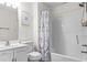 Bright bathroom featuring a shower-tub combo and stylish vanity at 26 Springbottom Dr, Lawrenceville, GA 30046