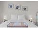 Well-lit bedroom featuring a comfortable bed with decorative wall art at 26 Springbottom Dr, Lawrenceville, GA 30046