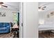 This bedroom has great natural light, vinyl flooring, and a connecting living space at 26 Springbottom Dr, Lawrenceville, GA 30046