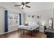 Bedroom featuring a modern bed frame, ceiling fan and natural light at 26 Springbottom Dr, Lawrenceville, GA 30046