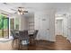 This breakfast nook has a ceiling fan, access to the deck, and overlooks the backyard at 26 Springbottom Dr, Lawrenceville, GA 30046