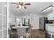 Open kitchen and dining area featuring stainless steel appliances and hardwood floors at 26 Springbottom Dr, Lawrenceville, GA 30046