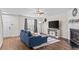 Bright living room with wood floors, modern furnishings, and plenty of natural light at 26 Springbottom Dr, Lawrenceville, GA 30046
