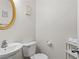 A clean powder room features a modern sink and gold framed mirror at 26 Springbottom Dr, Lawrenceville, GA 30046