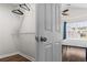 Walk-in closet with ample storage leading into the bedroom at 26 Springbottom Dr, Lawrenceville, GA 30046