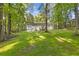 Spacious backyard featuring mature trees, perfect for privacy and outdoor activities at 2856 Bay Leaf Se Dr, Conyers, GA 30094