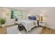 Cozy bedroom with natural light, complemented by stylish decor and wood-look floors at 2856 Bay Leaf Se Dr, Conyers, GA 30094