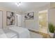 Bedroom showcasing colorful abstract art and featuring a bathroom with a glass shower at 2856 Bay Leaf Se Dr, Conyers, GA 30094
