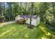 Beautiful home with a well-manicured lawn and a cozy front porch, set among mature trees at 2856 Bay Leaf Se Dr, Conyers, GA 30094