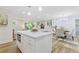 Spacious open-concept kitchen with a large center island, stainless steel appliances, and ample room for dining and socializing at 2856 Bay Leaf Se Dr, Conyers, GA 30094