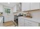 Well-appointed kitchen with white cabinetry, stainless steel appliances, and a functional layout for cooking and entertaining at 2856 Bay Leaf Se Dr, Conyers, GA 30094