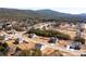 Aerial view of the neighborhood featuring numerous single-Gathering homes and mature trees with mountains in the background at 33 N Village Cir, Rydal, GA 30171