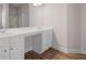 Bathroom featuring double vanity with modern fixtures and ample under sink storage at 33 N Village Cir, Rydal, GA 30171