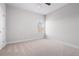 Well-lit bedroom with neutral walls, carpet flooring, and a window for natural light at 33 N Village Cir, Rydal, GA 30171