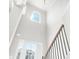 Bright foyer with soaring ceiling and a beautiful arched window above the front door at 33 N Village Cir, Rydal, GA 30171