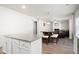 Open concept kitchen featuring a granite island that overlooks the living room at 33 N Village Cir, Rydal, GA 30171
