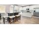 Modern kitchen featuring white cabinets, stainless steel appliances, and a large island with seating at 33 N Village Cir, Rydal, GA 30171