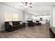 Open concept living area with hardwood floors flowing into a kitchen with modern appliances at 33 N Village Cir, Rydal, GA 30171
