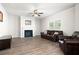 Spacious living room with a fireplace, hardwood floors, and large window providing natural light at 33 N Village Cir, Rydal, GA 30171