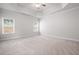 Spacious main bedroom featuring carpet, recessed lights, ceiling fan, and two windows for ample light at 33 N Village Cir, Rydal, GA 30171