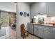 Updated bar area with custom cabinetry, granite countertops, and natural light at 122 Old Ivy Ne Rd # 17, Atlanta, GA 30342