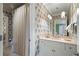 Bathroom featuring floral wallpaper, marble countertop, and a privacy curtain at 122 Old Ivy Ne Rd # 17, Atlanta, GA 30342