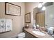 Bathroom featuring granite countertop, framed art, and monogramed towels at 122 Old Ivy Ne Rd # 17, Atlanta, GA 30342