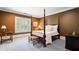 Bedroom with a four-poster bed, neutral walls, and great natural light at 122 Old Ivy Ne Rd # 17, Atlanta, GA 30342