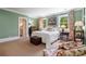 Comfortable bedroom featuring neutral carpeting, classic window treatments, and en suite access at 122 Old Ivy Ne Rd # 17, Atlanta, GA 30342