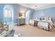 Charming blue bedroom featuring twin beds, window seat and soft neutral carpet at 122 Old Ivy Ne Rd # 17, Atlanta, GA 30342