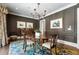 Formal dining room with wainscotting, chandelier, hardwood floors and stylish decor at 122 Old Ivy Ne Rd # 17, Atlanta, GA 30342