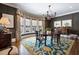 Formal dining room with wainscotting, a bay window, chandelier, and hardwood floors at 122 Old Ivy Ne Rd # 17, Atlanta, GA 30342