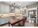 A stylish kitchen with modern cabinets, stainless hood, granite counters, and adjacent access to the living area at 122 Old Ivy Ne Rd # 17, Atlanta, GA 30342