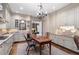 Well-appointed kitchen featuring granite countertops, ample cabinetry, stainless steel appliances, and a cozy dining area at 122 Old Ivy Ne Rd # 17, Atlanta, GA 30342