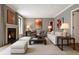 Elegant living room boasts a fireplace, neutral tones, and ample seating for a comfortable and inviting atmosphere at 122 Old Ivy Ne Rd # 17, Atlanta, GA 30342