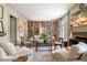 Inviting living room featuring a fireplace, built-in bookshelves and neutral paint at 122 Old Ivy Ne Rd # 17, Atlanta, GA 30342