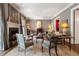 Elegant living room featuring a fireplace, a neutral color palette, and beautiful hardwood floors at 122 Old Ivy Ne Rd # 17, Atlanta, GA 30342