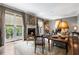 Light-filled living room with french doors, fireplace, and neutral tones, perfect for relaxing and entertaining at 122 Old Ivy Ne Rd # 17, Atlanta, GA 30342