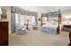 Spacious main bedroom featuring custom blue and white fabrics, sitting area and canopy bed at 122 Old Ivy Ne Rd # 17, Atlanta, GA 30342