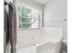 Bathroom featuring a bathtub with subway tile surround at 1921 Flint Hill Dr, Lawrenceville, GA 30044