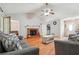 Relaxing living room with cozy sofas, brick fireplace, and views of the entrance and hallway at 1921 Flint Hill Dr, Lawrenceville, GA 30044