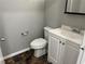 Cozy bathroom featuring a toilet and vanity sink at 20 Marietta Nw St # 7C, Atlanta, GA 30303